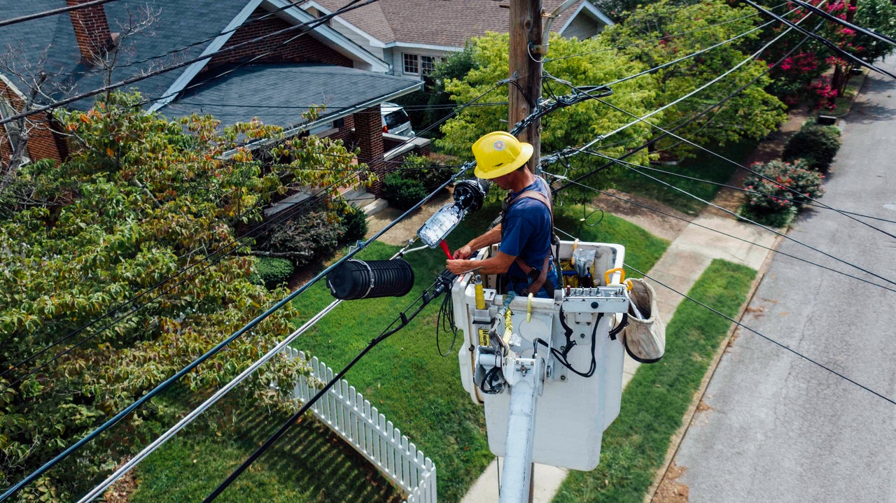 Utility worker works on attachment